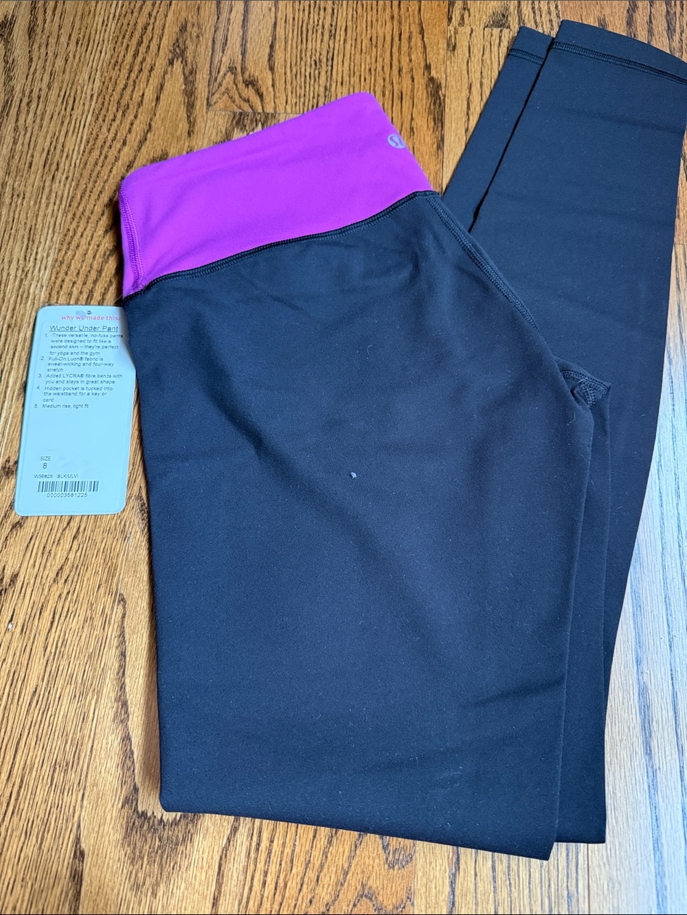 lululemon athletica Black Leggings with Bright Purple Fold-Over Waistband